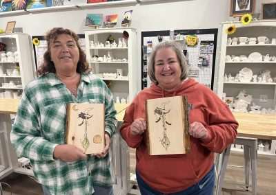 Halloween wood burning of witch hats and brooms