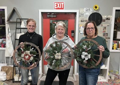 Wheel wreath with winter greenery